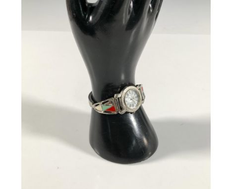 Etched stainless steel ring around white face with roman numerals. Enameled edges and stretch band for easy wear. Collezio Qu