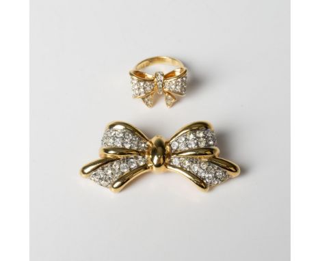18K yellow gold electroplate set with clear rhinestones. The brooch is unmarked and measures approximately 1"L x 2"W. The rin