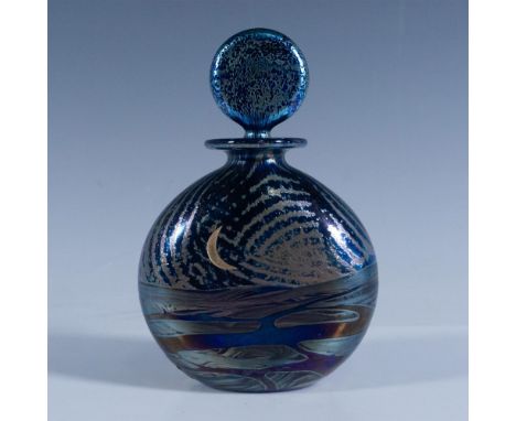 Gorgeous hand-crafted bottle and stopper made in iridescent blue glass. Artist signed on base. This item has its original box