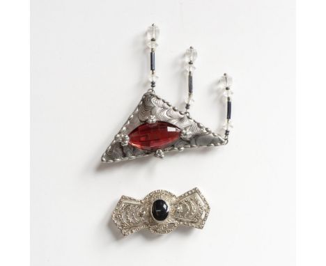 The larger brooch is a handmade triangle with dangling beads and an artist signature on the back. It has two pins on the back