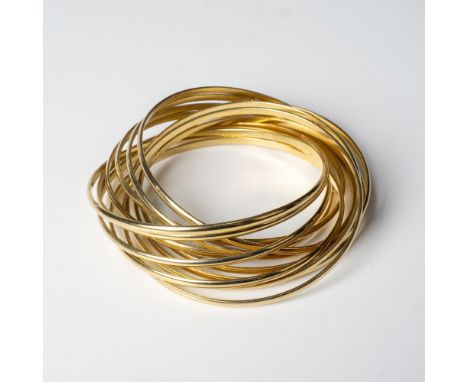 A dozen bangle bracelets all connected to form one piece. Dimensions: 2.75"dia. Condition: Age related wear. 