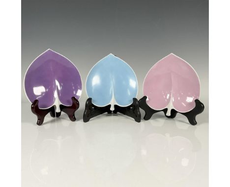 Three charming ring dishes shaped like leaves, featuring vibrant blue, pink, and purple hues with delicate white borders and 