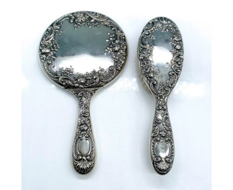 Gorgeous Gorham 26 sterling silver mirror with an art nouveau floral pattern measures 10"L x 5.5"W. Matching soft bristle bru
