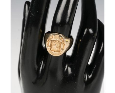This ring is 14k gold with a handsome lion crest with the name Spence. It features a banner with a name and date on the back.