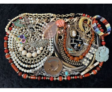 A Collection of Vintage Costume Jewellery to include necklaces, pearls, brooches, gold tone necklaces and bracelets etc.