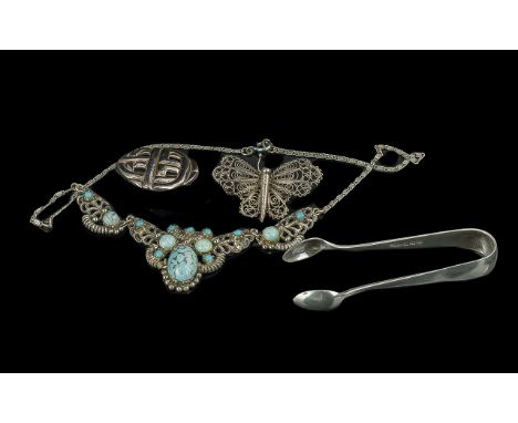 A Collection of Vintage Silver Items  to include silver filigree brooch, sugar tongs hallmarked for Birmingham 1925, makers J