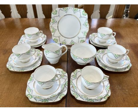 Roslyn Bone China Tea Service 'Fantasy', comprises six trios of cup, saucer and side plate, bread and butter plate, milk jug 