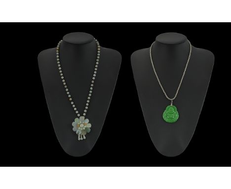 Two Necklets, comprising a jade and silver necklace and a Buddha in green.