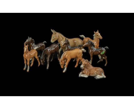 Collection of Seven Beswick Foals and a Beswick Donkey, and a Doulton foal.