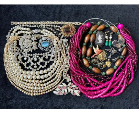 A Collection of Vintage Costume Jewellery to include necklaces, pearls, brooches, gold tone necklaces and bracelets etc.