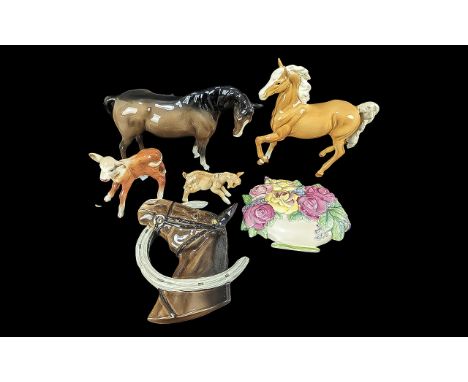 Collection of Beswick Figures, including a dark drown horse figure, a Palomino horse figure, two calves, a horses head with h