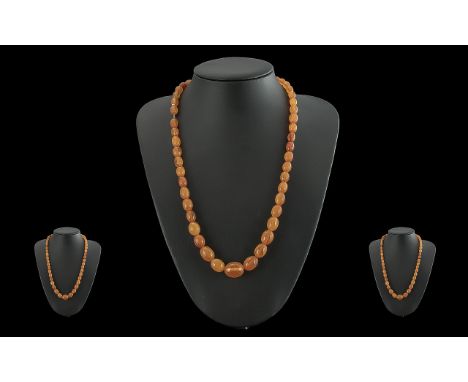 A Vintage Pleasing Butterscotch Amber  Beaded Necklace - Of Good Colour. Length 22'' (55cm) Weight 25.5 grams. Condition good