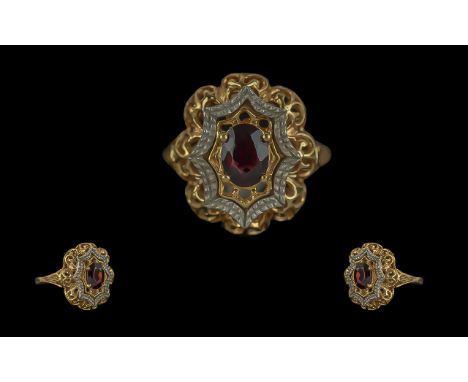 Ladies 18ct Gold Ruby Set Ring with ornate shank, marked 750 - 18ct to shank, the central ruby of good colour, ring size O, w