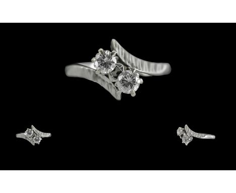 Ladies Attractive 18ct White Gold Two Stone Diamond Set Ring.  Full hallmark to interior of shank.  The two well-matched roun