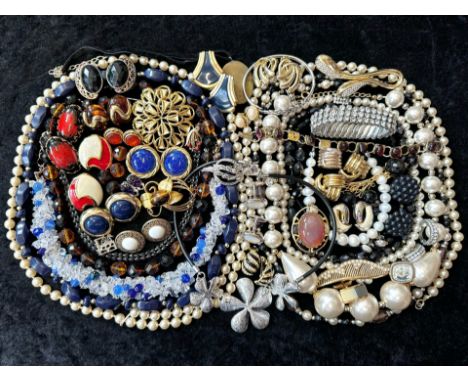 A Collection of Vintage Costume Jewellery to include necklaces, pearls, brooches, gold tone necklaces and bracelets etc.