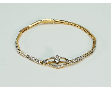 Feines Art déco-Armband 14 K Gold, bicolor, gestempelt. Längliche bewegliche Glieder gestalten dieses feines Armband, auf der