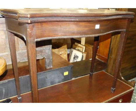 A Regency mahogany serpentine front fold-over baize lined card table, having rear gate leg action, raised on square supports,