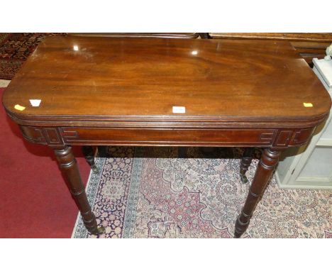 A Regency mahogany D-end foldover baize lined card table, having rear gate leg action, raised on ring turned supports, width 