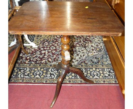 An early 19th century provincial walnut fixed top pedestal tripod occasional table, raised on bobbin turned column, width 58c