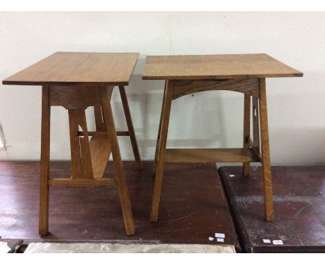 A pair of Arts &amp; Crafts light oak side tables, raised on squared outward supports united with a carved heart and a square