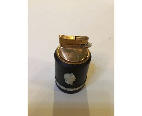 A Wedgwood 20th century Black Basalt Lighter With a profile of Caesar.Date: 20th century Size: 10cm high inc lighterCondition