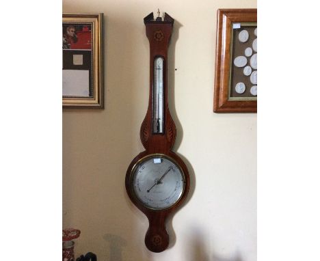 A George III mahogany banjo barometer and thermometer, indistinctly signed, inlaid decoration