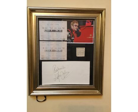 A framed Elton John autograph with tickets. Client was a concert ticket winner. 