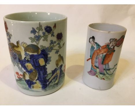 A pair of Oriental ceramic pots, the larger example depicting birds and smaller example depicting figures.Small Pot: 11.5cm h