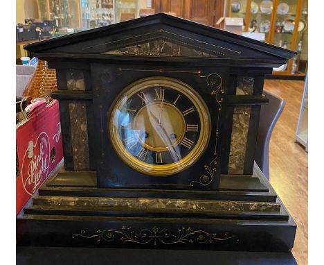 A late Victorian black slate and marble inset eight day mantle clock, architectural form, chapter ring with Roman numerals, p