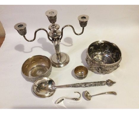 Seven items of Siam sterling silver, to include a triple candelabrum, three bowls, a large ladle and two smaller spoons (7)