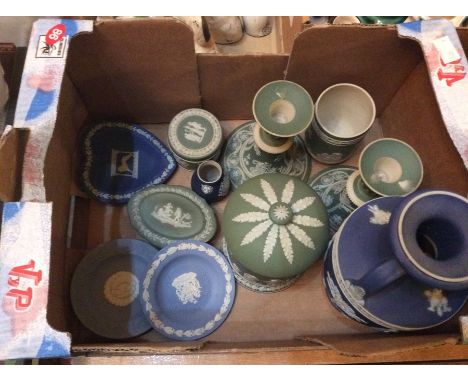 A collection of Wedgwood Jasperware, comprising an early 20th Century blue twin handled pedestal vase, a pair of green candle