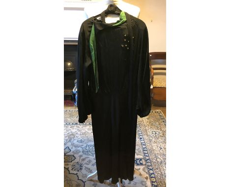 A black crepe 1936/37 day dress the neckline is edged in jade green crepe, jet embellishment on the bodice with cream dot pat