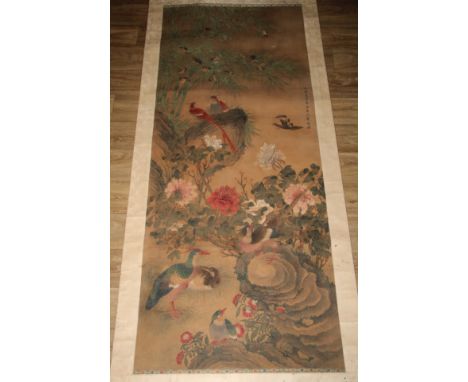 Chinese School, a scroll, ink and colour, painted with a fanciful birds, peonies and foliage, 195cm x 81cm 