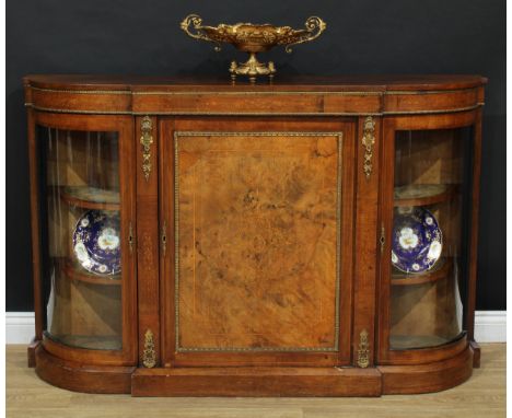 A Victorian gilt metal mounted walnut and marquetry&nbsp; break-centre credenza, slightly oversailing top above a panel door 