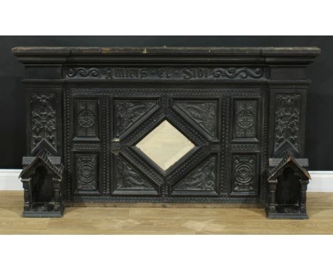 A Jacobean Revival oak overmantel, moulded pediment above a frieze applied in text with amicis et sibi, the lozenge shaped mi