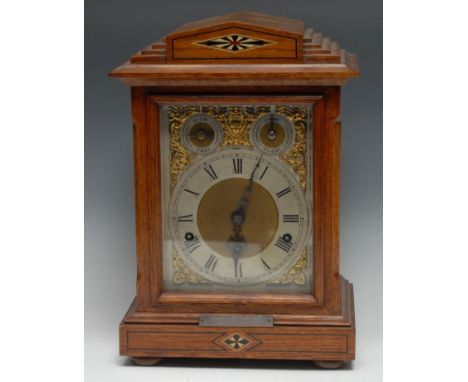 An early 20th century oak bracket clock, 16cm rectangular silvered dial with Roman numerals, Slow/Fast and Chime/Silent setti