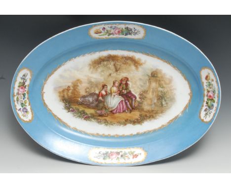 A large 19th century French  Sevres style oval serving plate, painted with  courting couple by ornate fountain, bleu celeste 