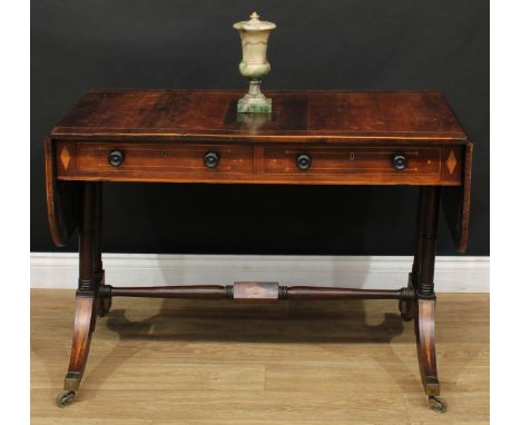 A Regency rosewood sofa table, rounded rectangular top with fall leaves above a pair of frieze drawers, blind to verso, ring-