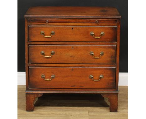 A George III Revival mahogany bachelor's chest, slightly oversailing top with reeded edge above a slide and three long gradua