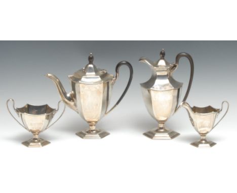 A George V silver four piece panelled urnular coffee service, comprising coffee pot, water jug, milk jug and sugar basin, the