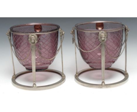 A pair of Adam design electroplated and cut-glass ice pails, amethyst flash liners, lion monopodia supports linked by loose c