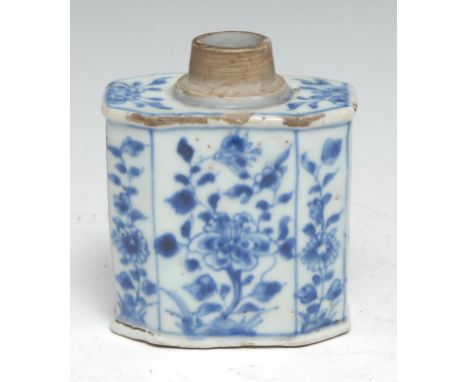 An early 18th century Chinese porcelain canted rectangular tea caddy or canister, painted in underglaze with panels of flower