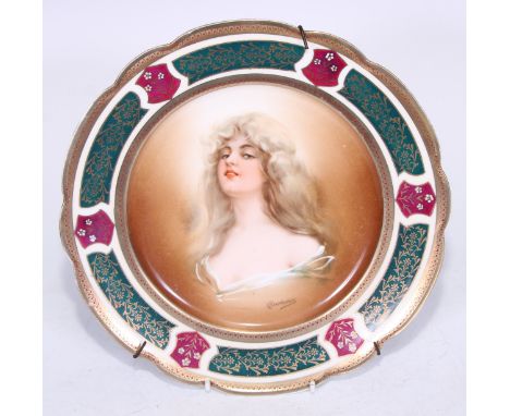 A Vienna shaped circular plate, printed and painted ith Constance, the rim alternating with six ruby shields each with white 