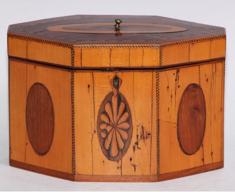 A satinwood, mahogany and marquetry lozenge shaped tea caddy, hinged cover enclosing a pair of lidded compartments, inlaid wi