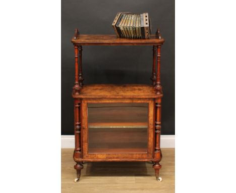 A Victorian walnut and marquetry music room cabinet, rounded rectangular top above an open undertier and a glazed door enclos