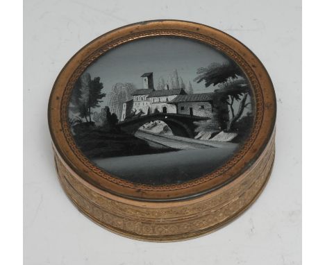 A 19th century French tooled and gilt card circular table snuff box, the glazed cover decorated en grisalle with a bridge and