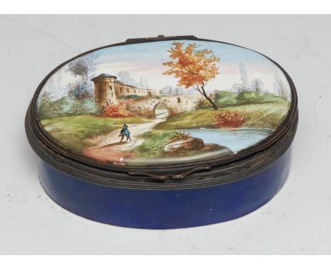 A Rococo Revival enamel oval table-top snuff box, the hinged cover painted with an Italianate landscape, dark blue base, 10.5