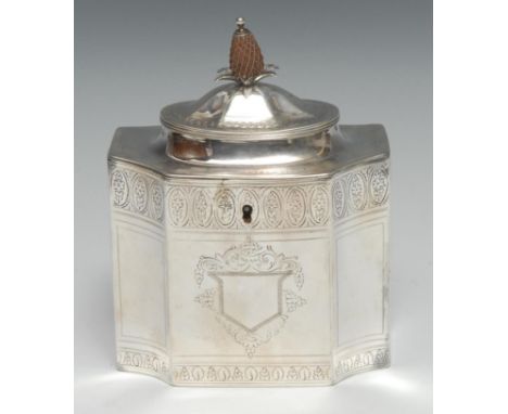 A George III silver tea caddy, hinged domed cover with pineapple finial, bright-cut engraved and outlined with wrigglework, c