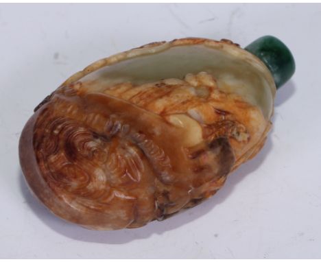 A Chinese ovoid jadeite snuff bottle, carved through layers of dark brown, brown and white to a pale celadon green, with anim