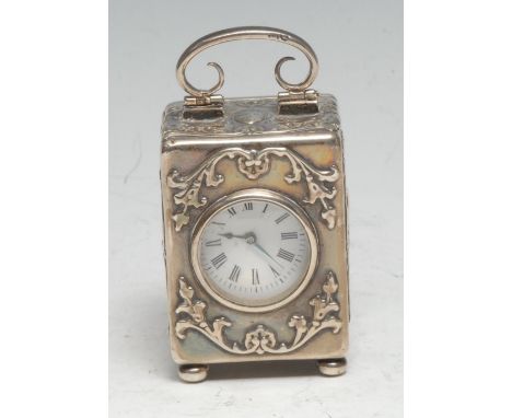 A late Victorian silver miniature carriage timepiece, 3cm enamel clock dial inscribed with Roman numerals, French movement, t